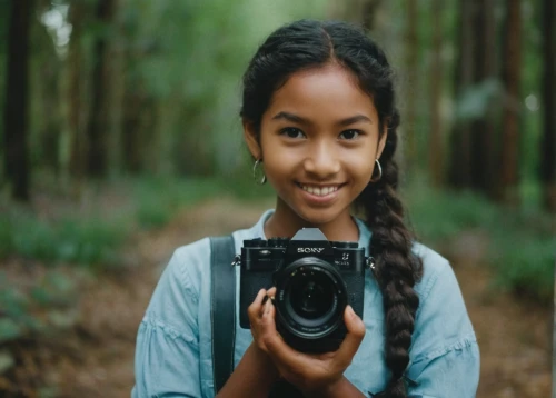 a girl with a camera,photographing children,canon 5d mark ii,digital slr,minolta,photo-camera,photo camera,dslr,slr camera,mirrorless interchangeable-lens camera,taking picture,digital camera,taking photo,portrait photographers,portrait photography,film camera,halina camera,nature photographer,photographer,camera photographer,Photography,Documentary Photography,Documentary Photography 01