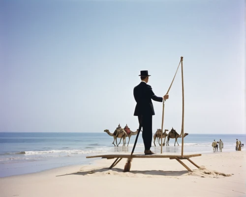 alphorn,the beach fixing,man at the sea,tightrope walker,hat stand,beach defence,clotheshorse,sand clock,mobile sundial,the tropic of cancer,standup paddleboarding,lubitel 2,sand timer,stilts,el salvador dali,equilibrist,great as a stilt performer,bellboy,beach furniture,deckchair,Photography,Black and white photography,Black and White Photography 13