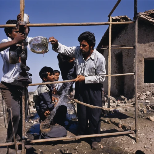 afghanistan,children playing,iraq,nomadic children,photographing children,color image,fetching water,tajikistan,kurdistan,baghdad,snake charmers,water well,children of war,children studying,year of construction 1954 – 1962,year of construction 1972-1980,war correspondent,photos of children,construction work,afar tribe,Photography,Documentary Photography,Documentary Photography 12
