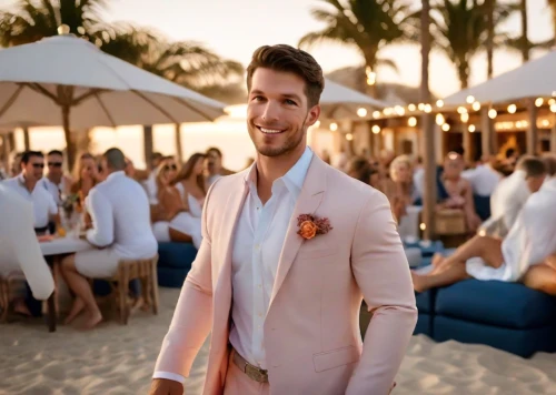 wedding suit,man in pink,the groom,men's suit,groom,bridegroom,umbrella beach,pink tie,the suit,dress shirt,groom bride,male model,beach restaurant,cosmopolitan,formal guy,businessman,sweater vest,commercial,pink beach,beach bar