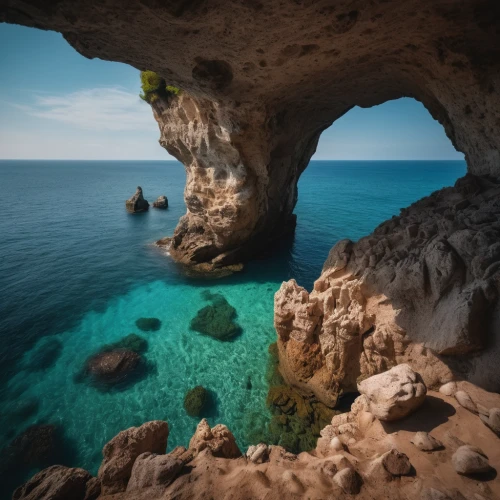 cave on the water,sea cave,sea caves,limestone arch,algarve,natural arch,the blue caves,blue caves,petra tou romiou,puglia,sardinia,three point arch,rock arch,balearic islands,cliffs ocean,blue cave,aphrodite's rock,the mediterranean sea,limestone cliff,the balearics,Photography,General,Cinematic