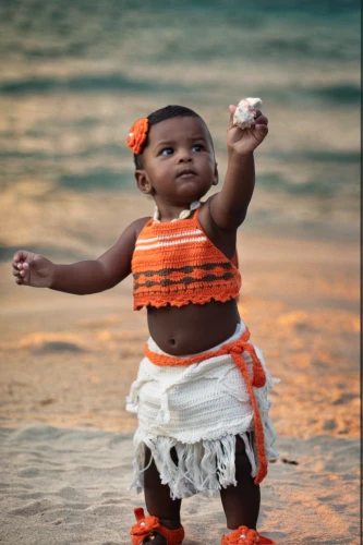 little girl twirling,newborn photo shoot,african culture,polynesian girl,newborn photography,baby & toddler clothing,moana,afro american girls,aborigine,sweet potato,children's photo shoot,babies accessories,african american woman,orange,playing in the sand,holding a coconut,african woman,cape verde island,beautiful african american women,cocoa bean