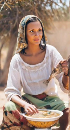 eritrean cuisine,tassili n'ajjer,african woman,anmatjere women,ethiopian girl,woman holding pie,ethiopian food,afar tribe,traditional food,bahian cuisine,rajasthani cuisine,couscous,nomadic people,sudan,injera,bedouin,woman at the well,samburu,nigeria woman,girl with cereal bowl