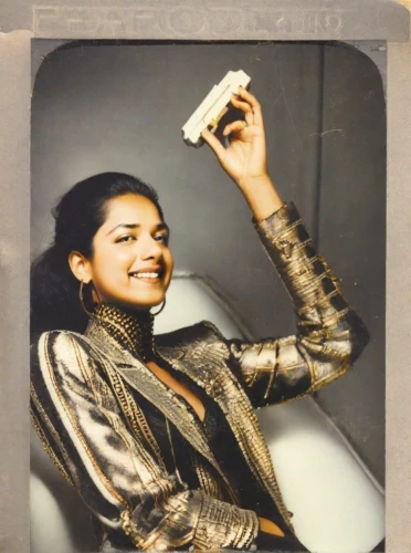woman holding a smartphone,polaroid pictures,polaroid,instant camera,70s,vintage asian,digital camera,60s,1971,model years 1960-63,disposable camera,vintage camera,woman eating apple,video phone,digital photo frame,model years 1958 to 1967,photographic film,1973,70's icon,telephone accessory