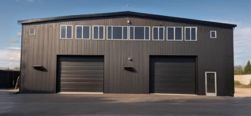 garage door,garage,prefabricated buildings,roller shutter,garage door opener,metal cladding,locomotive shed,shed,frame house,sheds,metal roof,automobile repair shop,hangar,loading dock,folding roof,storage medium,fire station,automotive exterior,boat shed,field house