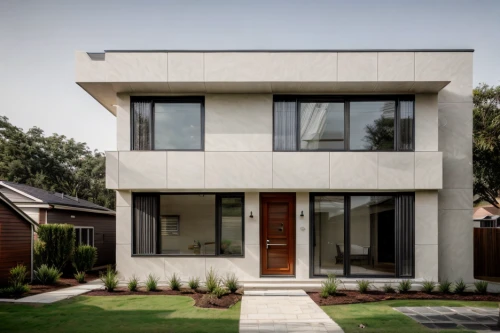 cubic house,modern architecture,exposed concrete,stucco frame,house shape,concrete construction,modern house,reinforced concrete,mid century house,concrete blocks,folding roof,cube house,frame house,smart house,metal cladding,stucco wall,concrete,residential house,geometric style,dunes house