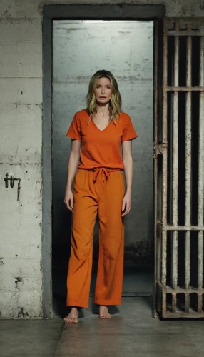 prisoner,jumpsuit,prison,pantsuit,handcuffed,orange,in custody,arbitrary confinement,queen cage,yellow jumpsuit,madonna,criminal,orange robes,murderer,shackles,captivity,coveralls,chainlink,evil woman,soprano,Photography,Documentary Photography,Documentary Photography 27