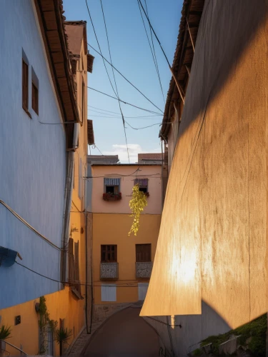 narrow street,casa fuster hotel,alleyway,riad,outdoor street light,street lamp,old linden alley,alley,zona colonial,street lamps,goldenlight,lipari,townhouses,street light,majorelle blue,malaga,hanging houses,townscape,streetlamp,streetlight,Photography,General,Realistic