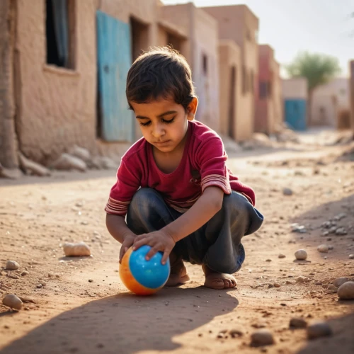 child playing,playing with ball,jaisalmer,nomadic children,pakistani boy,children playing,sudan,world children's day,street football,fetching water,sahara,children play,baby playing with toys,mali,stick and ball games,bedouin,hoggar,durman,children of war,child protection,Photography,General,Commercial