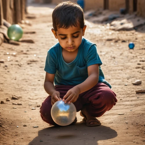 child playing,nomadic children,crystal ball-photography,children playing,world children's day,playing with ball,pakistani boy,jaisalmer,sand timer,bedouin,ball fortune tellers,children play,girl with cereal bowl,water balloon,fetching water,children of war,crystal ball,morocco lanterns,yemeni,photographing children,Photography,General,Natural