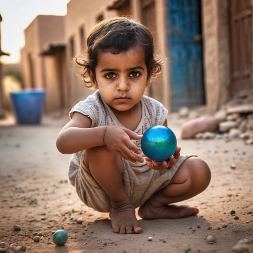 child playing,playing with ball,crystal ball-photography,little girl with balloons,world children's day,nomadic children,baby playing with toys,yemeni,jaisalmer,pakistani boy,juggling,water balloon,children of war,bedouin,photographing children,libya,child protection,poverty,syrian,children play,Photography,General,Commercial