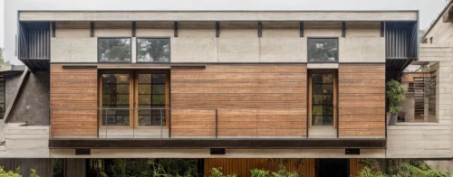 timber house,wooden facade,metal cladding,wooden house,dunes house,modern house,mid century house,cubic house,residential house,modern architecture,ruhl house,exposed concrete,wooden windows,corten steel,two story house,frame house,core renovation,facade panels,glass facade,house shape,Architecture,General,Modern,Natural Sustainability