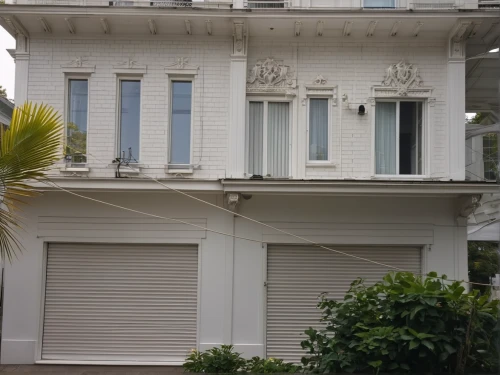 house with caryatids,paris balcony,french windows,window with shutters,shutters,plantation shutters,house facade,french building,art nouveau,classical architecture,house front,wooden shutters,exterior decoration,sicily window,balcon de europa,entablature,art nouveau frames,neoclassical,bay window,facade painting,Photography,General,Realistic