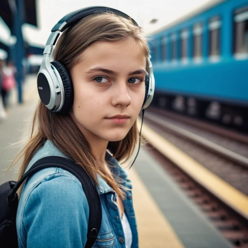 the girl at the station,listening to music,headphones,headphone,wireless headphones,wireless headset,music on your smartphone,audio player,girl with speech bubble,head phones,walkman,tinnitus,audio accessory,listening,mp3 player accessory,earphone,music,earphones,audiophile,train whistle,Photography,General,Realistic