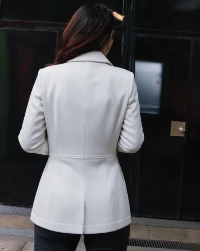 woman's backside,bolero jacket,white coat,girl from the back,girl from behind,white-collar worker,business woman,woman walking,revolving door,woman in menswear,businesswoman,girl walking away,white skirt,back view,sprint woman,baby back view,back of head,ass,rear view,concierge