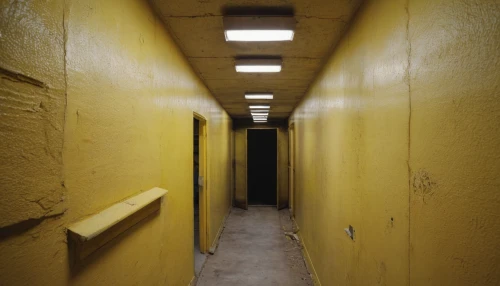 penumbra,hallway,yellow light,yellow wall,corridor,basement,hallway space,creepy doorway,dormitory,abandoned room,the morgue,asylum,urbex,darkroom,empty interior,security lighting,disused,air-raid shelter,rooms,blind alley,Photography,General,Commercial