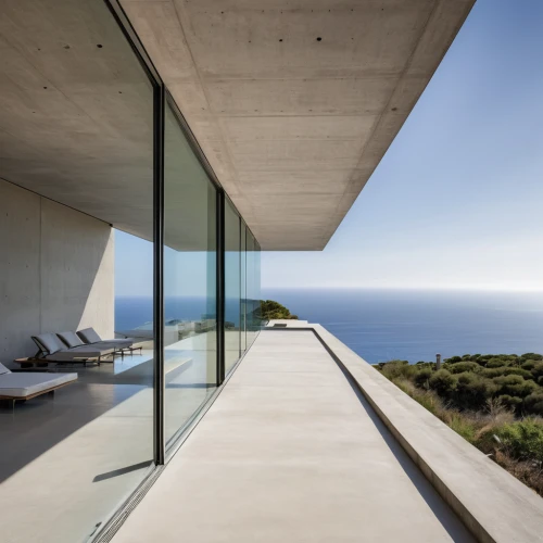 dunes house,exposed concrete,modern architecture,window with sea view,glass wall,structural glass,archidaily,glass facade,luxury property,concrete construction,the balearics,skyscapers,modern house,concrete slabs,concrete ceiling,summer house,cubic house,beach house,holiday villa,sicily window,Photography,General,Realistic