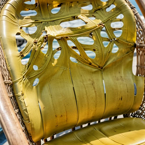 harness seat of a paraglider pilot,chaise longue,deckchair,basket wicker,hanging chair,rocking chair,armchair,deck chair,fuselage,wing chair,aircraft engine,wicker basket,pineapple basket,beach chair,parabolic mirror,helicopter rotor,old chair,camping chair,jewelry basket,patio furniture,Photography,General,Realistic