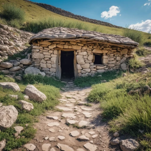 iron age hut,stone oven,ancient house,alpine hut,stone house,mountain hut,tuff stone dwellings,the threshold of the house,stone houses,mountain huts,blockhouse,traditional house,small house,mountain settlement,house in mountains,empty tomb,small cabin,burial chamber,neolithic,little house,Photography,General,Realistic