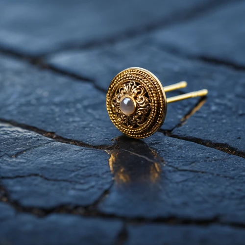 golden ring,sun dial,sundial,gold watch,square bokeh,depth of field,background bokeh,poker chip,watchmaker,macro shooting,ring with ornament,gold rings,cobblestone,pocket watch,tilt shift,map pin,macro photography,gold jewelry,macro extension tubes,mobile sundial,Photography,General,Realistic