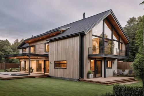 timber house,wooden house,danish house,modern house,modern architecture,smart home,eco-construction,house shape,smart house,half-timbered,wooden decking,slate roof,half timbered,two story house,new england style house,folding roof,wooden construction,modern style,frame house,inverted cottage