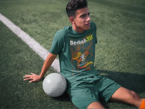 playing football,soccer player,football player,soccer,freestyle football,footbag,footballer,futsal,soccer kick,soccer ball,footbal,pallone,handball player,futebol de salão,ronaldo,pakistani boy,itamar kazir,sports jersey,street football,soccer field