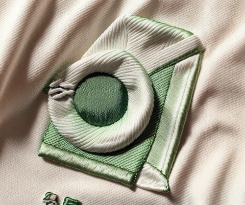 green and white,sewing button,green folded paper,bed linen,isolated product image,handkerchief,sage green,sewing buttons,cufflink,pocket flap,dishcloth,embroider,green sail black,linen,sewing notions,quilt,product photography,coin purse,chanel,linen heart