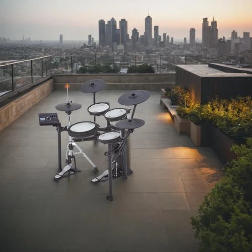 roof terrace,music instruments on table,roof landscape,roof garden,helipad,roof top,electronic drum,outdoor table,roof domes,rooftops,outdoor grill,drum kit,above the city,outdoor furniture,aerial landscape,rooftop,drum set,on the roof,outdoor table and chairs,percussions