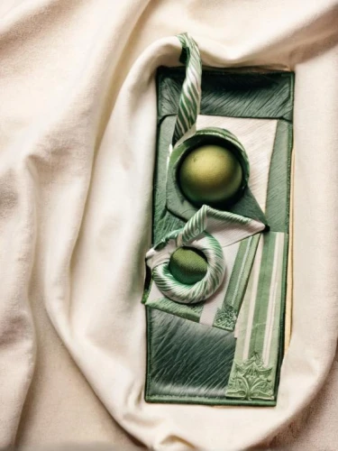 still life photography,olive butter,green folded paper,sage green,olive in the glass,linen,still life with onions,place setting,crème de menthe,raw silk,egg tray,still-life,linen heart,olive oil,tea still life with melon,green and white,bird's egg,olive family,bed linen,egg dish