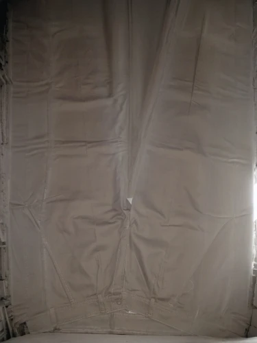 a curtain,mosquito net,stage curtain,empty sheet,duvet cover,vehicle cover,theater curtain,curtain,theater curtains,bed sheet,slipcover,tarp,theatre curtains,inflatable mattress,corrugated sheet,drapes,duvet,projection screen,wing paraglider inflated,large tent