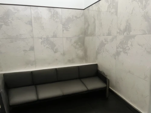 rest room,wall plaster,wall completion,doctor's room,wall panel,stucco wall,tiled wall,ceramic tile,wall texture,conference room,washroom,examination room,shower bar,seating area,ceramic floor tile,therapy room,consulting room,furnished office,corner,meeting room