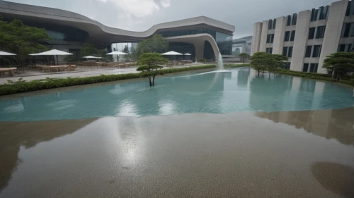 reflecting pool,shenzhen vocational college,infinity swimming pool,hurricane benilde,flooded pathway,outdoor pool,floor fountain,puddle,suzhou,heart of love river in kaohsiung,swimming pool,zhengzhou,exposed concrete,water mirror,water feature,water channel,houston texas apartment complex,diamond lagoon,pool of water,puddles,Photography,General,Realistic
