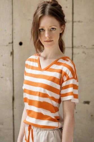 orange,gap kids,horizontal stripes,girl in t-shirt,orange color,pippi longstocking,bright orange,orange half,child model,striped background,polo shirt,cotton top,retro girl,stripes,children is clothing,striped,girl in overalls,in a shirt,young model,orla