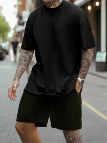 sleeve,long-sleeved t-shirt,rugby short,tattoos,jogger,cycling shorts,tattooed,long-sleeve,shorts,skater,active shorts,punk,running,ink,with tattoo,skort,male model,runner,man's fashion,pedestrian