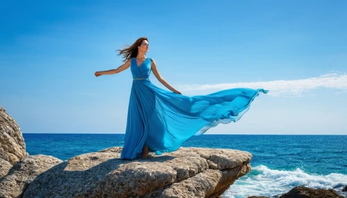 girl in a long dress,celtic woman,gracefulness,blue moment,divine healing energy,mermaid background,blue waters,shades of blue,the wind from the sea,blue enchantress,freedom from the heart,sea breeze,aphrodite's rock,ocean blue,leaving your comfort zone,deep blue,mermaid silhouette,girl on the dune,blue water,ocean background,Photography,General,Realistic
