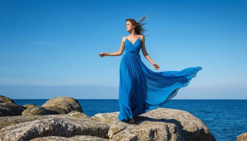 girl in a long dress,mazarine blue,girl in a long dress from the back,blue enchantress,long dress,celtic woman,evening dress,flamenco,gracefulness,blue moment,blue waters,female model,ocean blue,the wind from the sea,passion photography,shades of blue,blue dress,blue water,aphrodite's rock,sea breeze,Photography,General,Realistic