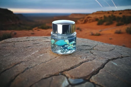 message in a bottle,lensball,glass container,mountain spirit,isolated bottle,perfume bottle,monument valley,poison bottle,water and stone,mirror in a drop,genuine turquoise,natural perfume,bottle surface,glass jar,hand sanitizer,drift bottle,capture desert,natural water,water drop,splash water
