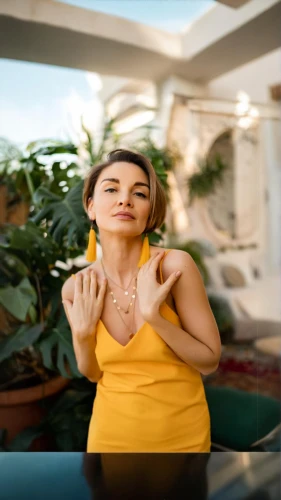dua lipa,woman eating apple,the gesture of the middle finger,yellow jumpsuit,palm reading,yellow background,commercial,woman holding a smartphone,victoria smoking,lotus with hands,align fingers,cigar,woman sitting,namaste,vitamin c,solar plexus chakra,woman hands,e-cigarette,hd,smoking girl