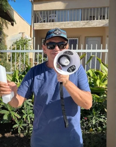 handheld electric megaphone,electric megaphone,trainer with dolphin,megaphone,vuvuzela,holding a coconut,hotel man,bullhorn,free reed aerophone,ko olina resort,coffee donation,local trumpet,water winner,costa rican colon,party dad,anmatjere man,punta-cana,augmented reality,mailman,trumpet of jericho