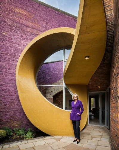 corten steel,sculptor ed elliott,circular staircase,crooked house,moray,winding staircase,christ chapel,philharmonic hall,red bricks,disney hall,winding steps,sandstone wall,smoot theatre,coventry,music conservatory,brickwork,outside staircase,curves,arts loi,walt disney concert hall