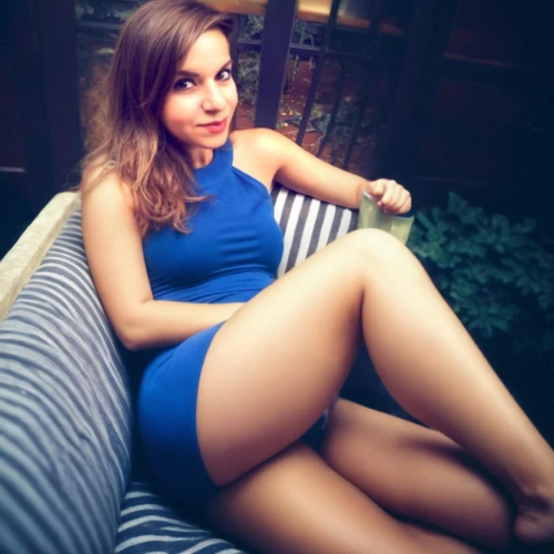 blue dress,sitting on a chair,legs crossed,crossed legs,ammo,beautiful legs,blue shoes,blue,blue and white,romanian,looking through legs,on the couch,deckchair,short dress,sitting,bare legs,lounger,one-piece swimsuit,balcony,deck chair
