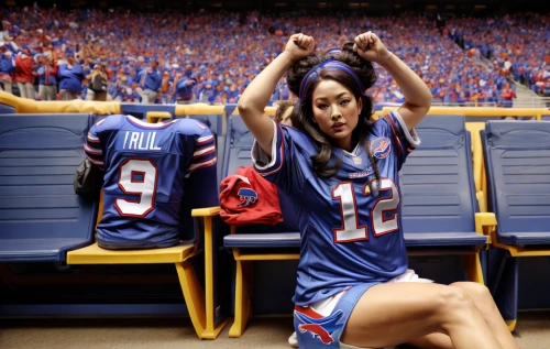 sports girl,sports jersey,cheerleader,nfl,indoor american football,sports uniform,autographed sports paraphernalia,sports fan accessory,cheerleading uniform,national football league,touch football (american),football player,women's football,super bowl,sports,american football,cheering,football fan accessory,kneeling,quarterback