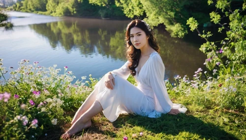 beautiful girl with flowers,ao dai,girl in white dress,spring background,meadow,girl in flowers,springtime background,beauty in nature,girl in a long dress,girl on the river,background view nature,girl in the garden,girl lying on the grass,landscape background,live in nature,photographic background,flower background,spring nature,green background,image editing,Photography,General,Realistic