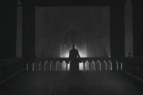 film noir,haunted cathedral,the nun,eerie,man silhouette,the silhouette,dark gothic mood,dracula,silhouette,pilgrimage,silhouette of man,woman silhouette,in the shadows,ominous,hall of the fallen,silhouetted,cinematography,silent film,angel of death,vigil