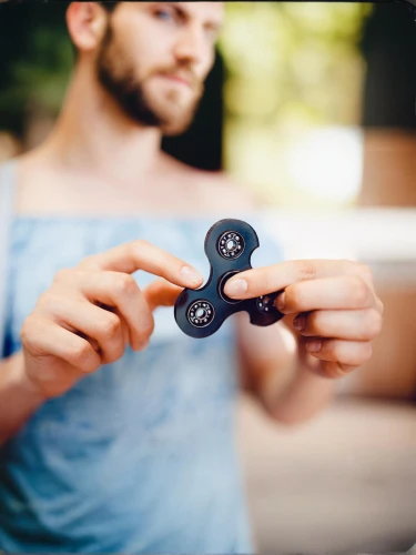 fidget toy,bicycle lock key,bottle opener,yo-yo,inflatable ring,skateboarding equipment,skate guard,roller sport,autism infinity symbol,product photos,roll skates,electrical tape,sewing button,measuring tape,carabiner,roll tape measure,fitness tracker,artistic roller skating,handheld device accessory,game joystick