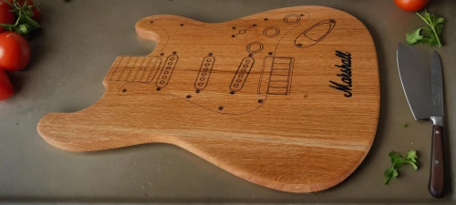 cutting board,chopping board,cuttingboard,luthier,bass guitar,guitar easel,fender,jazz bass,electric bass,painted guitar,wood board,squier,timbale,embossed rosewood,slide guitar,torta caprese,sun bass,stringed instrument,wooden plate,wooden instrument