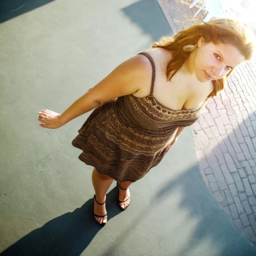 a girl in a dress,girl in a long dress,female model,torn dress,plus-size model,girl on the stairs,short dress,senior photos,in a shadow,day dress,image editing,looking down,sheath dress,lens flare,portrait photography,woman walking,pregnant woman,girl walking away,photo shoot with edit,long dress