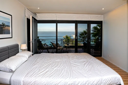 window with sea view,sleeping room,guest room,ocean view,guestroom,room divider,great room,modern room,bedroom window,las olas suites,hotelroom,contemporary decor,fisher island,boutique hotel,sea view,canopy bed,hotel room,hotel barcelona city and coast,window treatment,luxury hotel