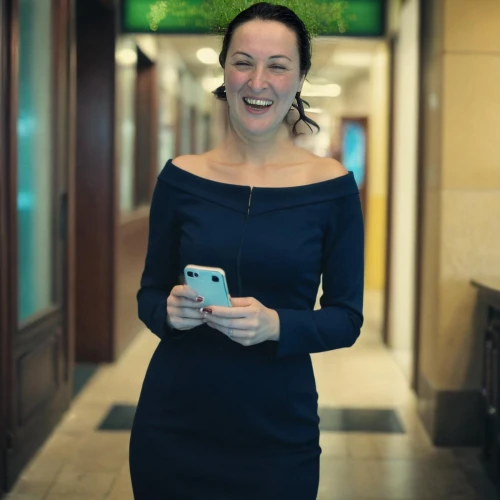 woman holding a smartphone,bank teller,concierge,business girl,receptionist,business woman,businesswoman,bussiness woman,customer service representative,sales person,stock exchange broker,visa card,mobile banking,salesgirl,bank card,gift card,social,staff video,visa,woman drinking coffee