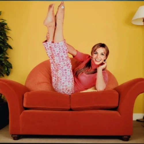 sofa,flexible,sofa set,couch,sofa bed,commercial,sitting on a chair,blonde on the chair,pink chair,legs crossed,crossed legs,new concept arms chair,flexibility,leg extension,cross-legged,recliner,lindsey stirling,cross legged,yoga pose,armchair
